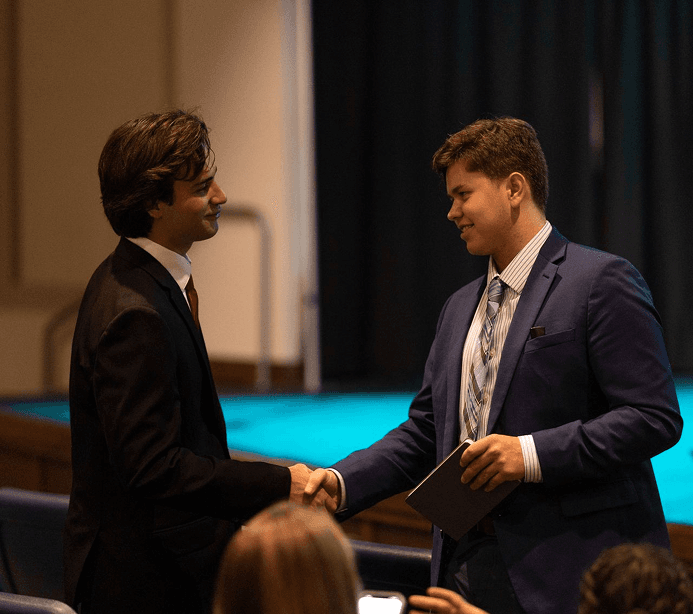 Handshake between an employer and an Institute Scholar